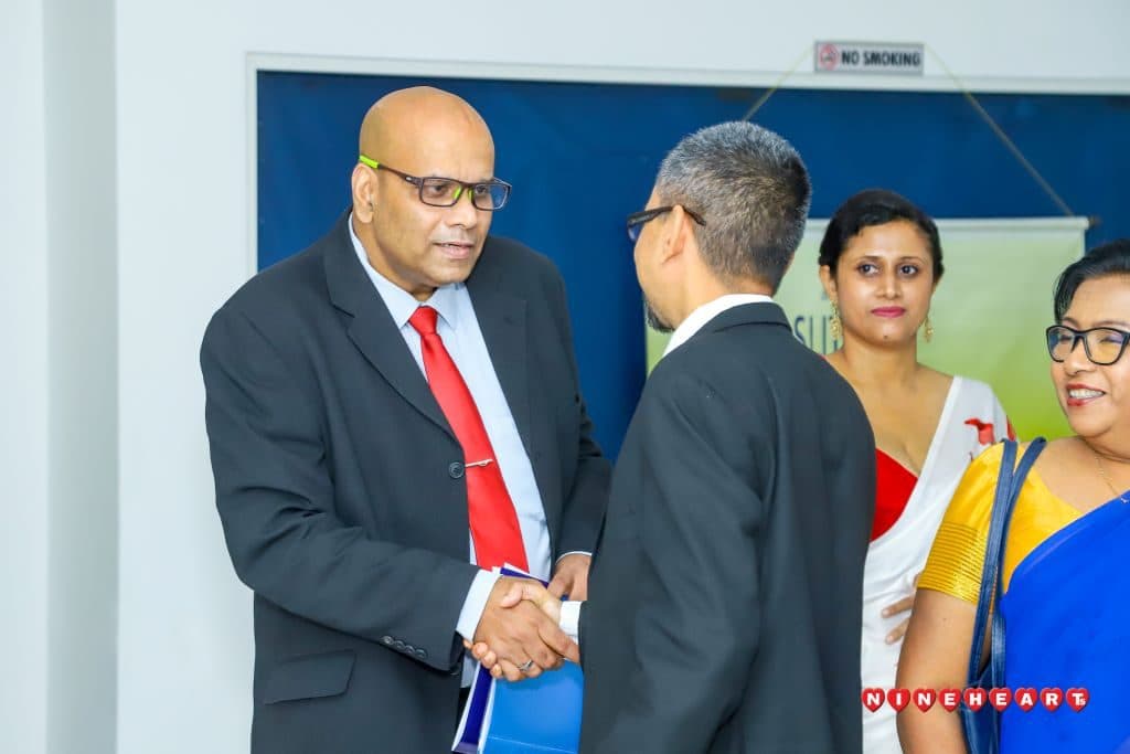 Council members greet guests at the Annual General Meeting