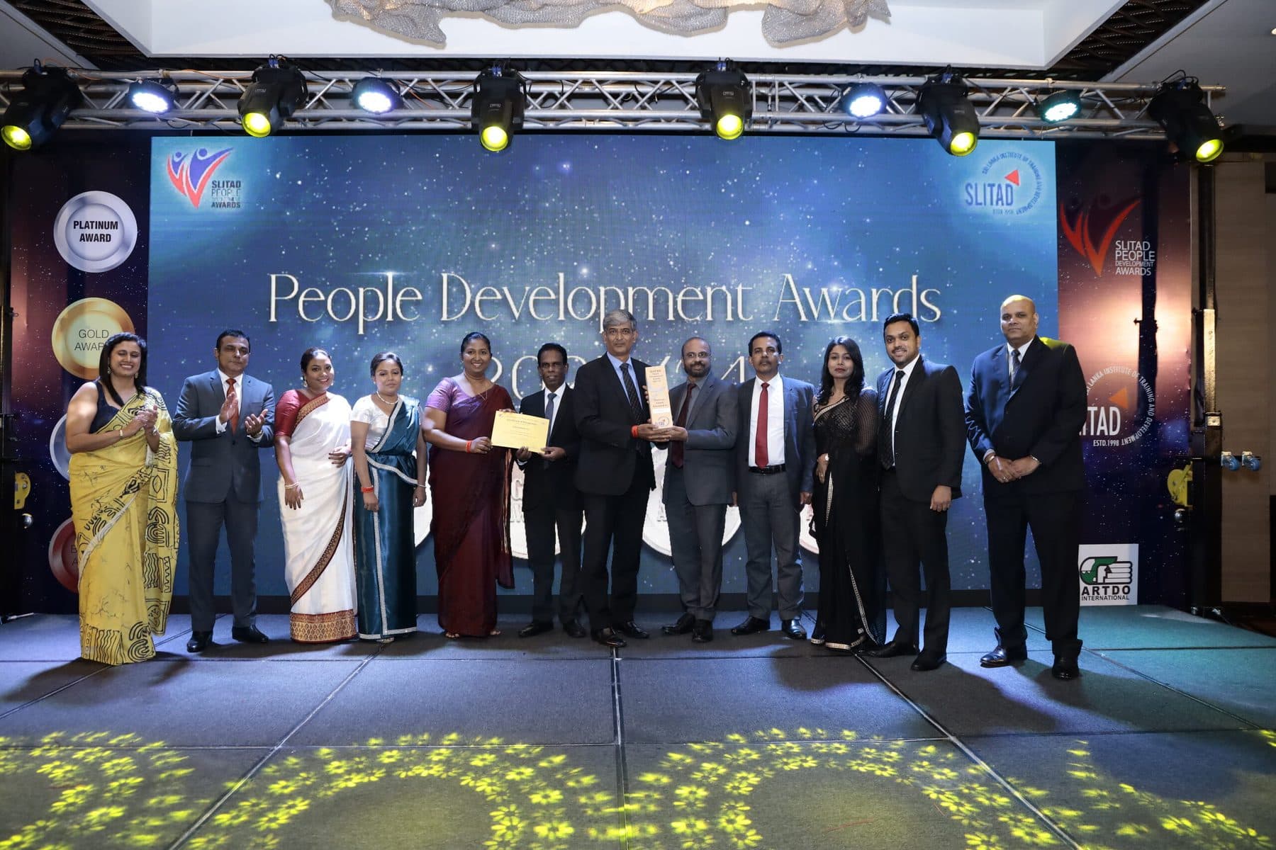 Award winners and the Executive Council on stage at the People Development Awards